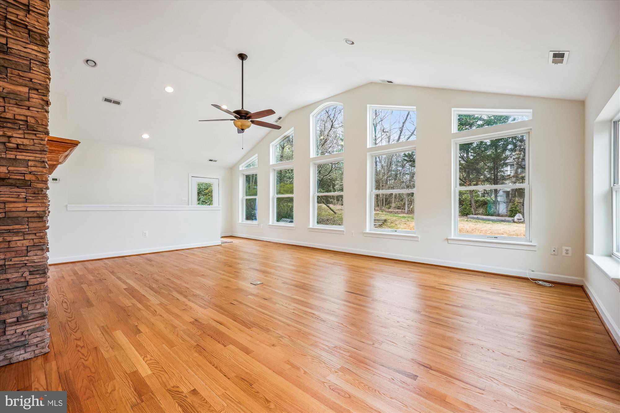 411 Pershing Drive Silver Spring, MD 20910 - Photo 25 of 64 a view of an empty room with wooden floor and a window