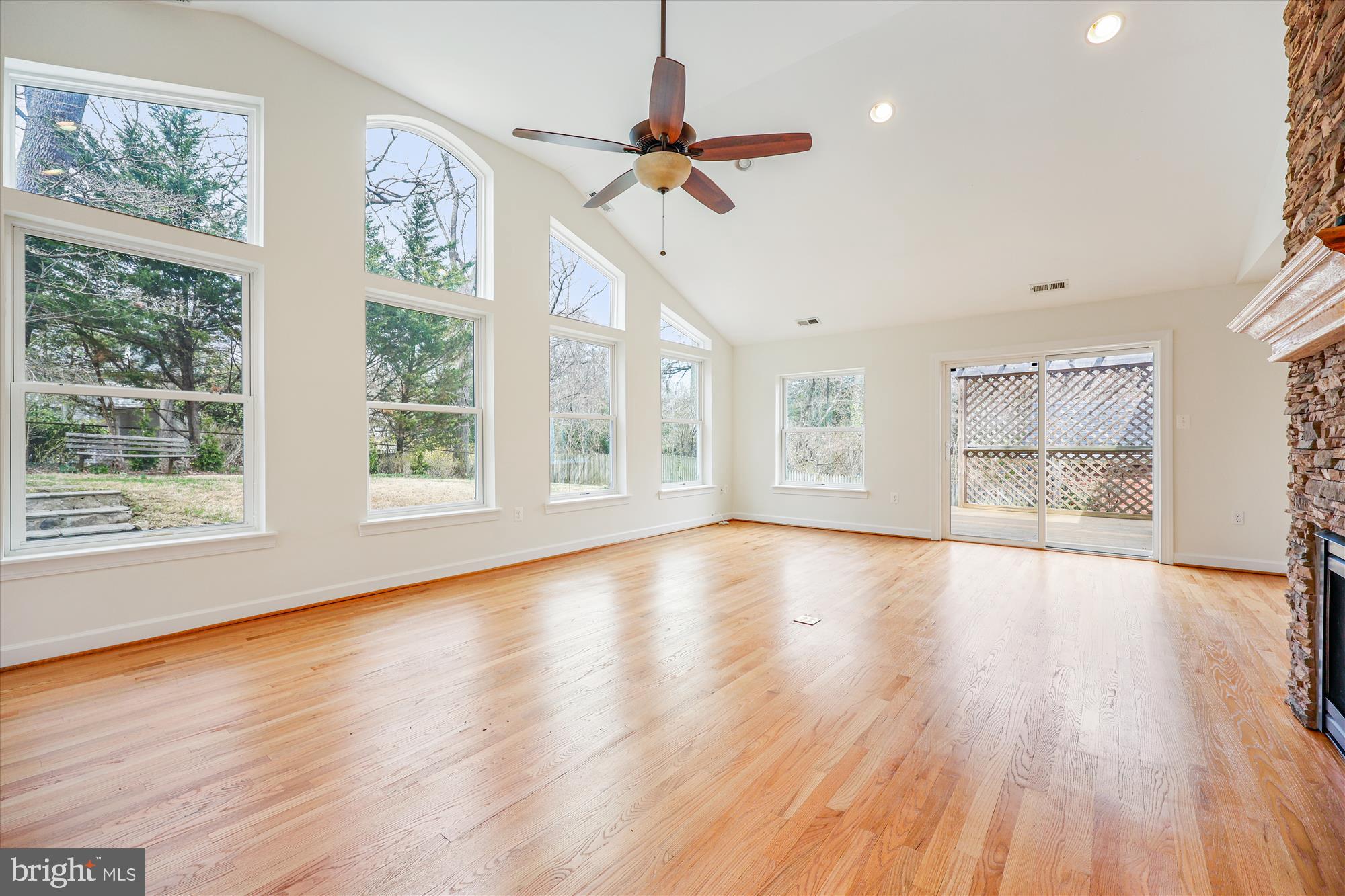411 Pershing Drive Silver Spring, MD 20910 - Photo 26 of 64 a view of an empty room with a window and wooden floor