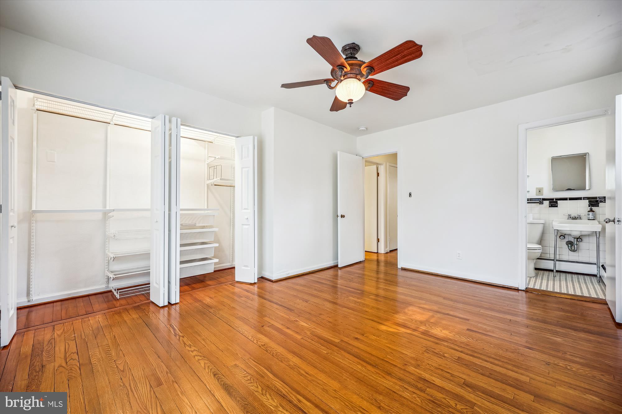 411 Pershing Drive Silver Spring, MD 20910 - Photo 32 of 64 a view of empty room with wooden floor and ceiling fan