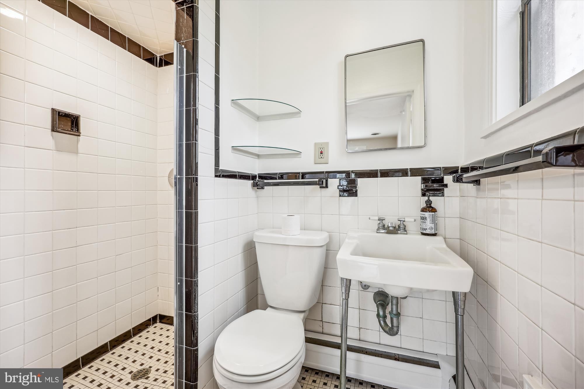 411 Pershing Drive Silver Spring, MD 20910 - Photo 35 of 64 a bathroom with a toilet a sink and a shower