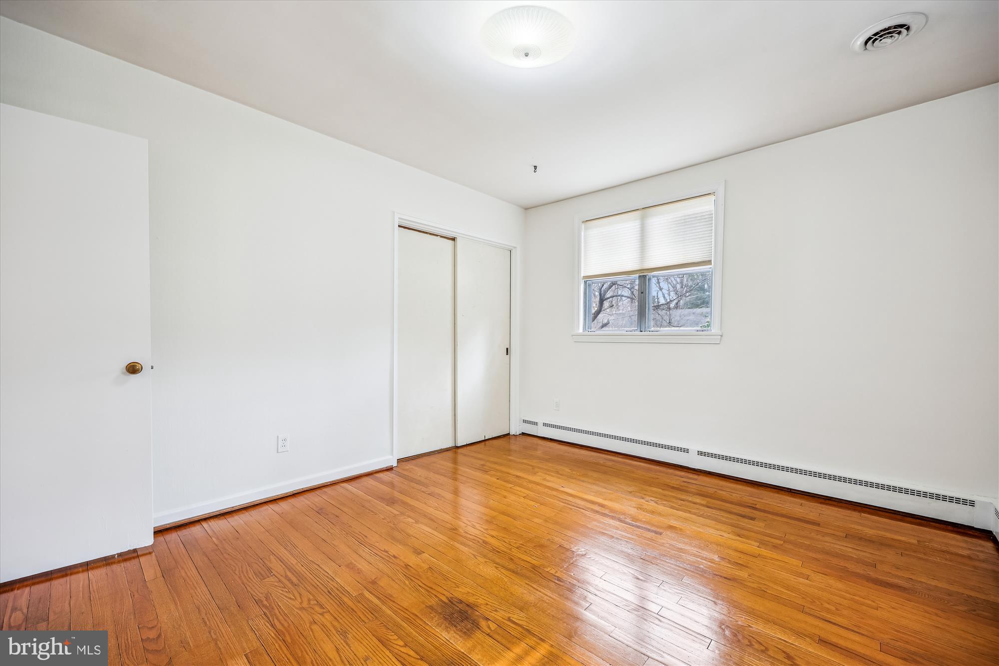 411 Pershing Drive Silver Spring, MD 20910 - Photo 38 of 64 a view of empty room with wooden floor