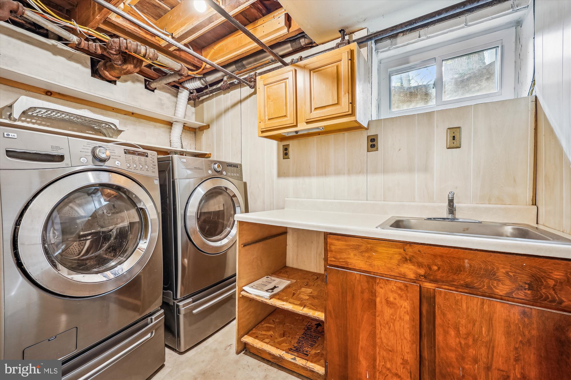 411 Pershing Drive Silver Spring, MD 20910 - Photo 53 of 64 a utility room with dryer and washer