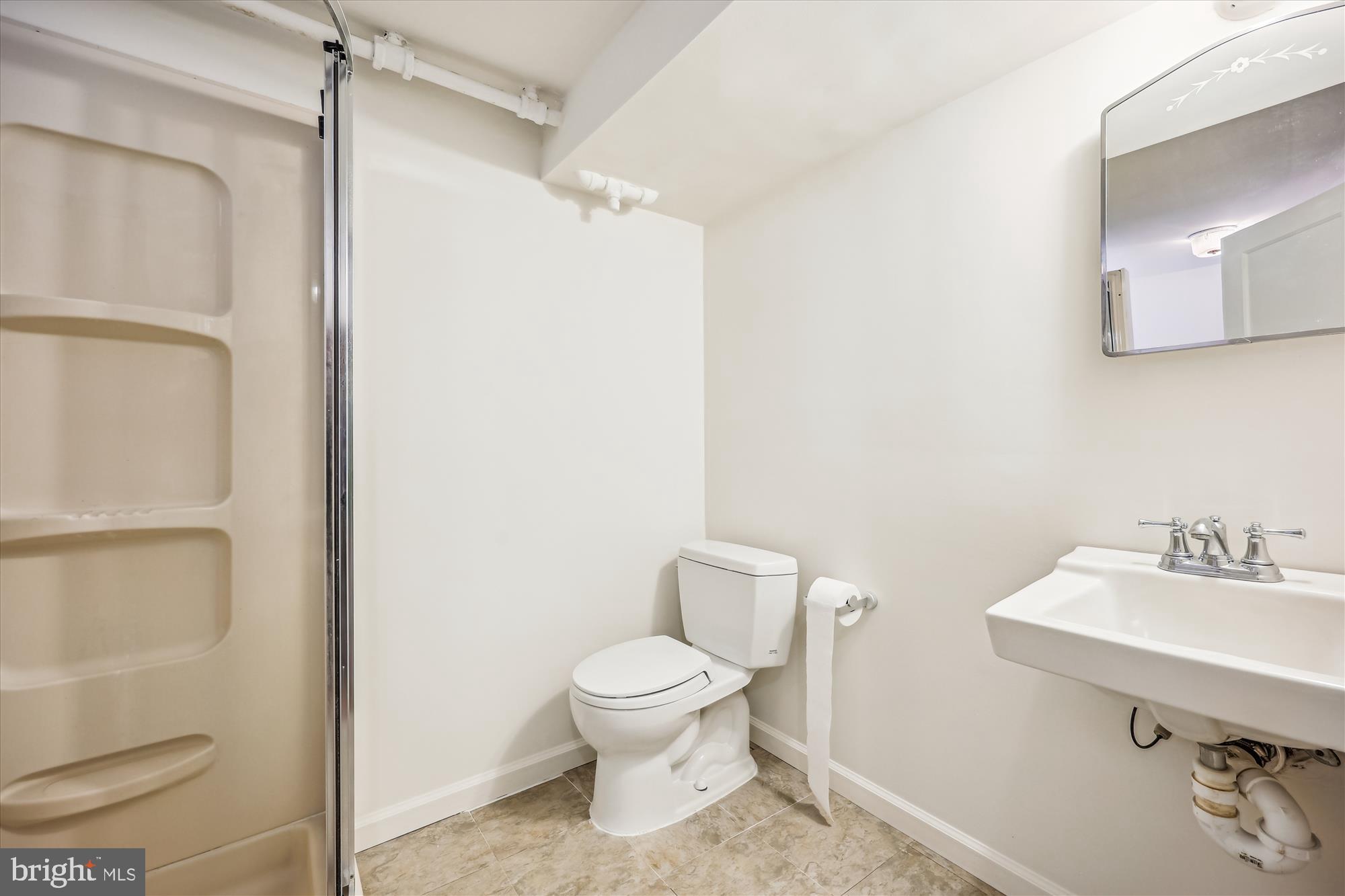 411 Pershing Drive Silver Spring, MD 20910 - Photo 60 of 64 a bathroom with a toilet sink and shower