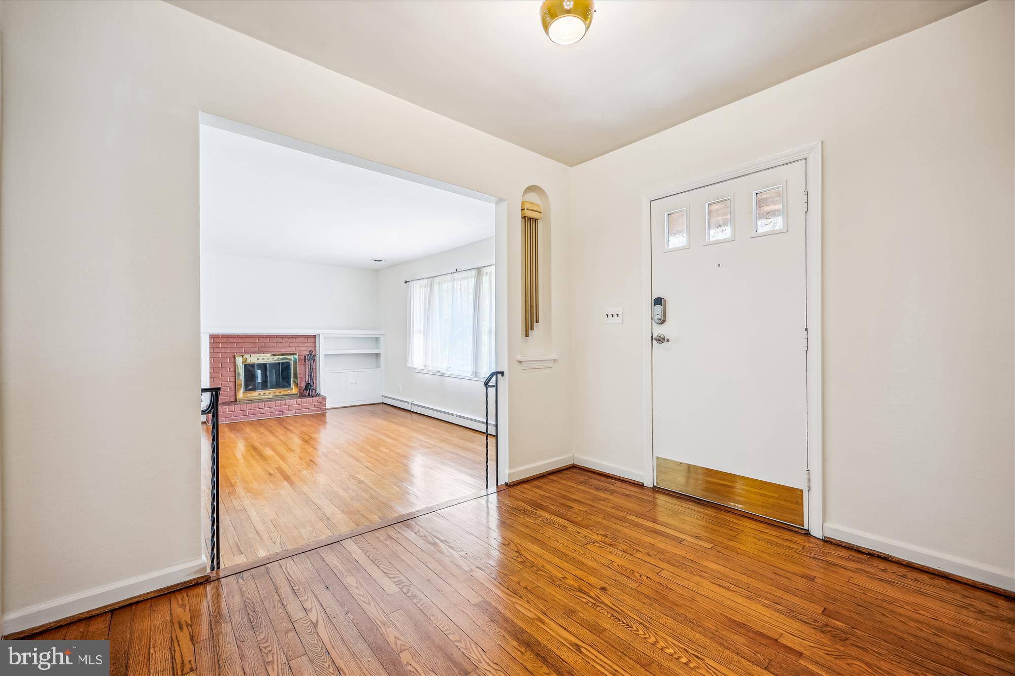 411 Pershing Drive Silver Spring, MD 20910 - Photo 8 of 64 wooden floor in an empty room with a window