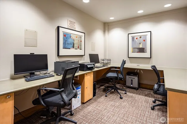 a view of a workspace with furniture