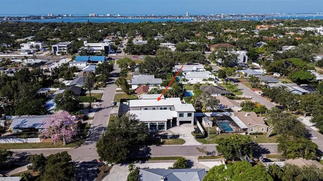 an aerial view of residential houses with outdoor space