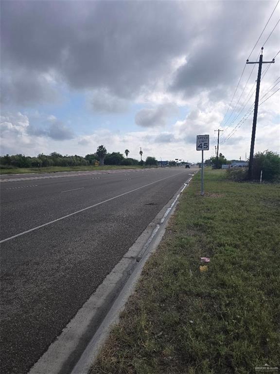 0 West Mile 7 Road Mission, TX 78574 - Photo 2 of 4 a view of a city street next to a building