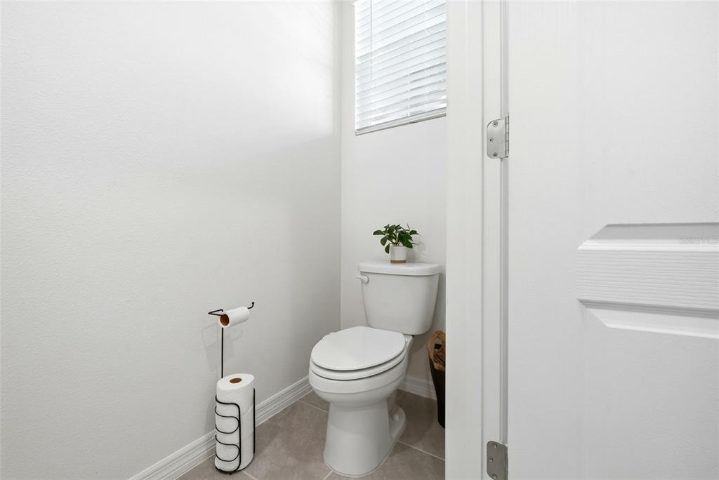 1503 Isleta Loop Kissimmee, FL 34741 - Photo 17 of 50 a white toilet sitting next to a shower