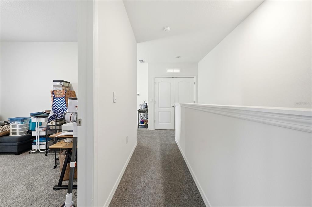 1503 Isleta Loop Kissimmee, FL 34741 - Photo 20 of 50 a view of hallway with livingroom