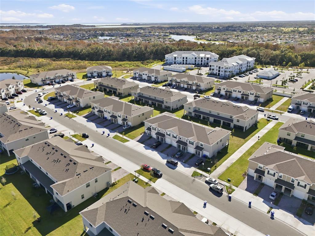 1503 Isleta Loop Kissimmee, FL 34741 - Photo 43 of 50 an aerial view of a city with lots of residential buildings and mountain view in back