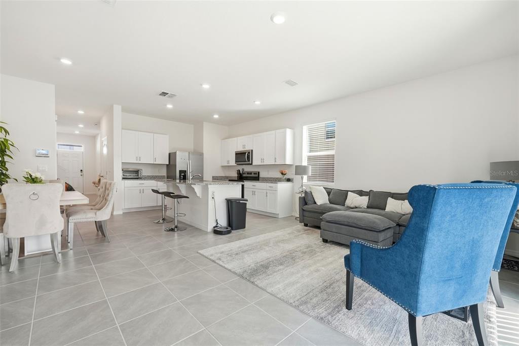1503 Isleta Loop Kissimmee, FL 34741 - Photo 7 of 50 a living room with furniture and kitchen view