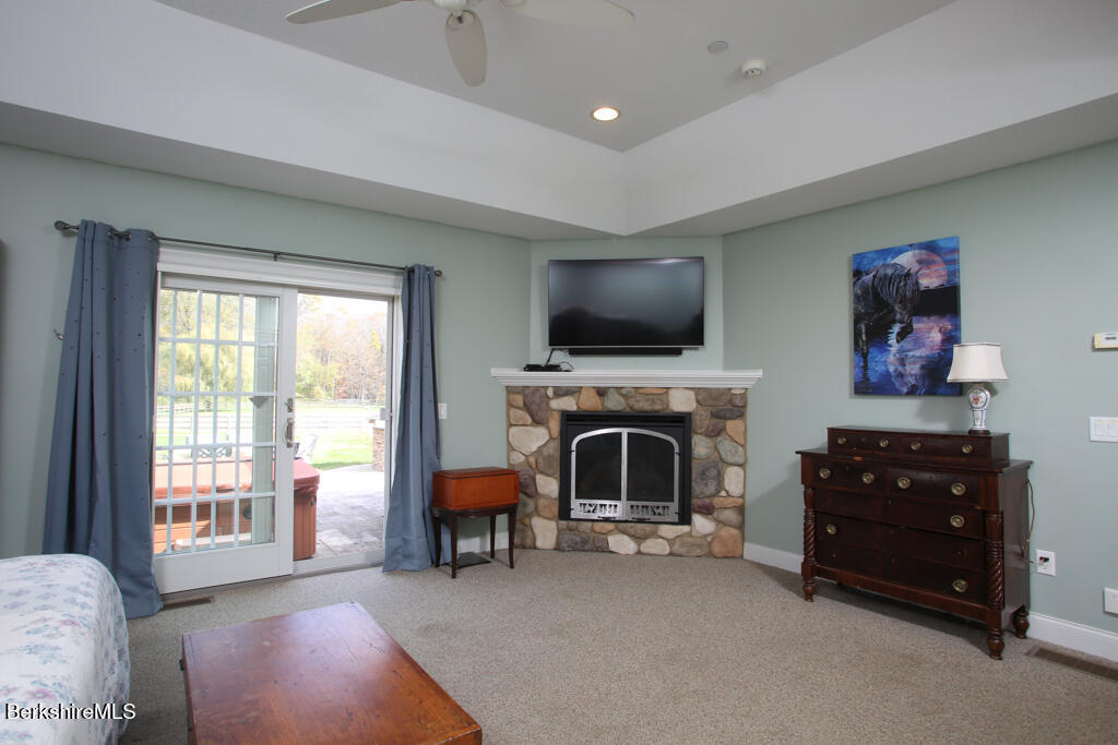 200 Easthampton Road Westhampton, MA 01027 - Photo 14 of 69 a living room with furniture a flat screen tv and a fireplace