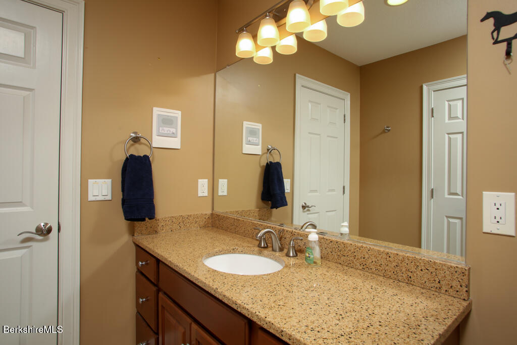 200 Easthampton Road Westhampton, MA 01027 - Photo 16 of 69 a bathroom with a granite countertop sink and a mirror
