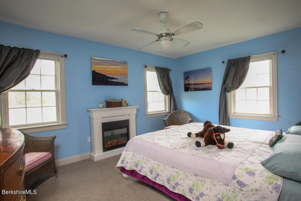 200 Easthampton Road Westhampton, MA 01027 - Photo 18 of 69 a bedroom with a bed and a flat screen tv