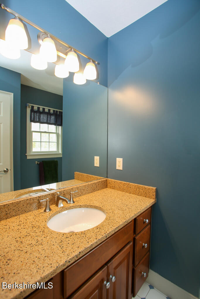 200 Easthampton Road Westhampton, MA 01027 - Photo 19 of 69 a bathroom with a granite countertop sink and a mirror