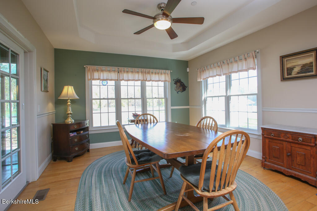 200 Easthampton Road Westhampton, MA 01027 - Photo 22 of 69 a dining room with furniture a chandelier and wooden floor