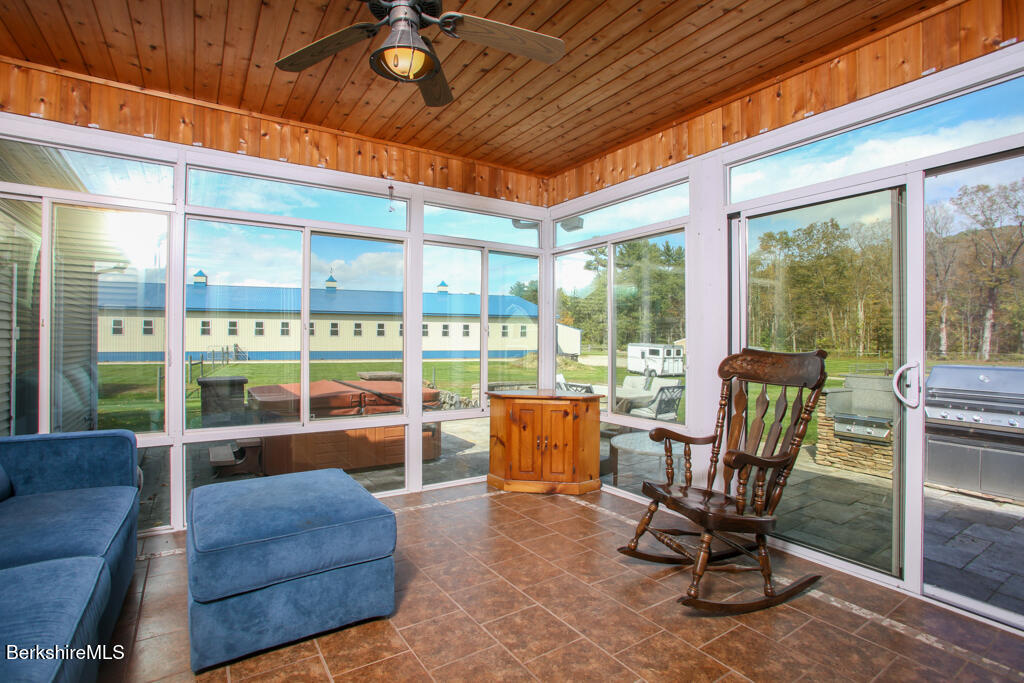 200 Easthampton Road Westhampton, MA 01027 - Photo 24 of 69 a living room with furniture and a floor to ceiling window