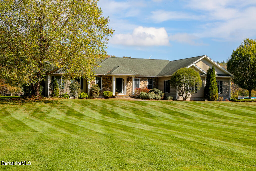 200 Easthampton Road Westhampton, MA 01027 - Photo 3 of 69 a front view of a house with a garden
