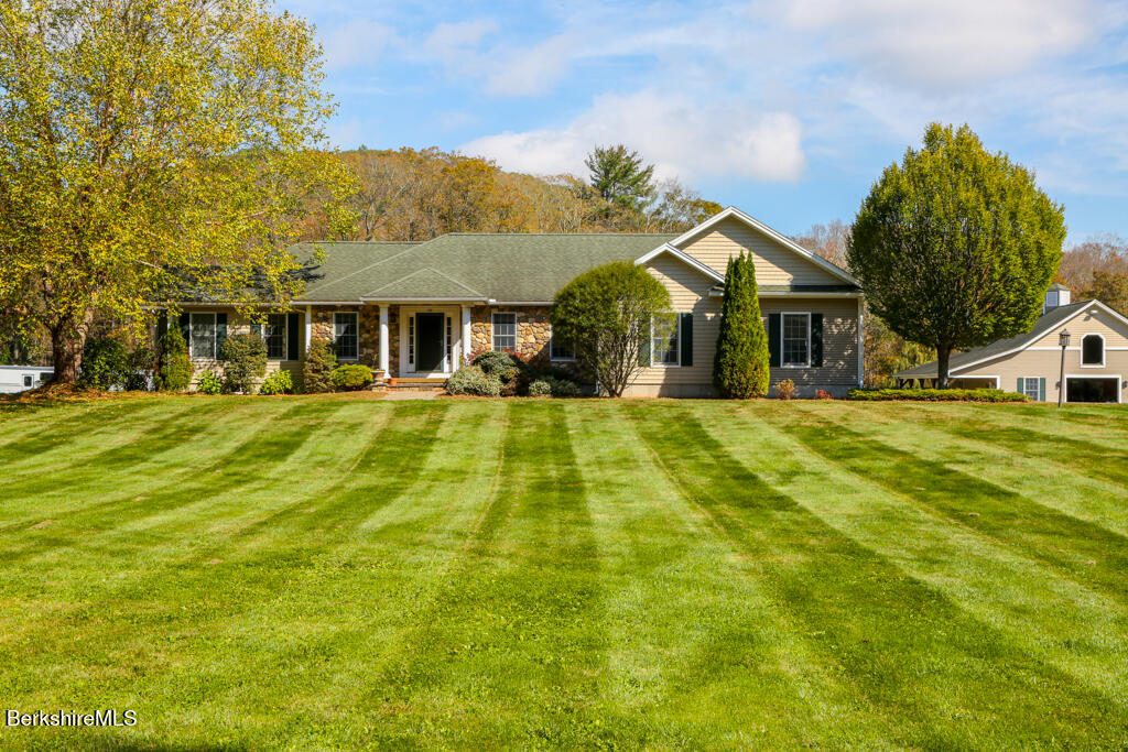 200 Easthampton Road Westhampton, MA 01027 - Photo 4 of 69 a view of a big house with a big yard and large trees