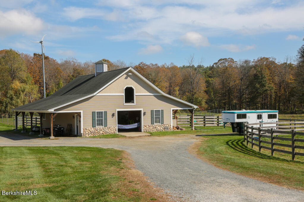 200 Easthampton Road Westhampton, MA 01027 - Photo 56 of 69 a view of a white house with a big yard and potted plants