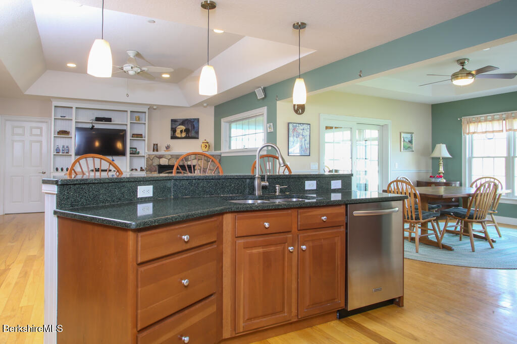 200 Easthampton Road Westhampton, MA 01027 - Photo 8 of 69 a kitchen with stainless steel appliances granite countertop a sink and a living room view