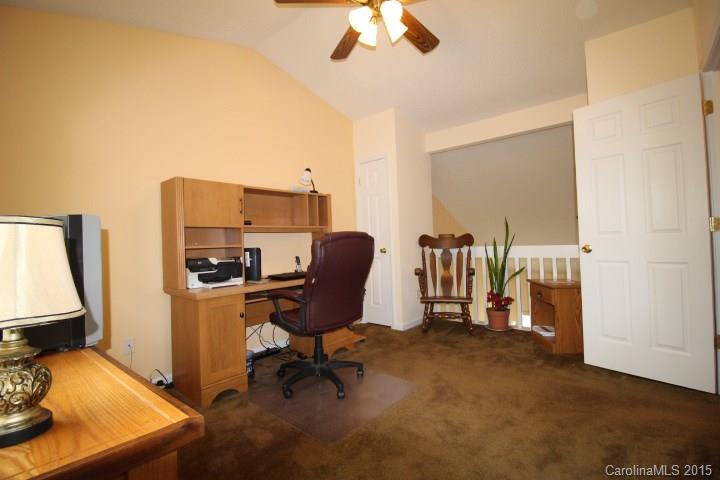 8304 Rudolph Road, Unit 8304 Charlotte, NC 28216 - Photo 14 of 20 a view of a workspace with furniture and a window