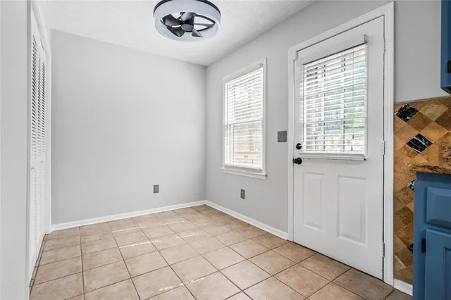 a view of an empty room and window