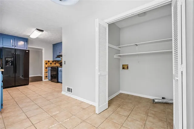 a view of a storage & utility room with closet