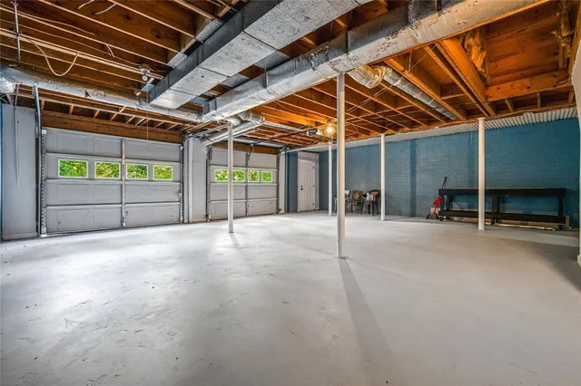 a view of empty room with wooden walls
