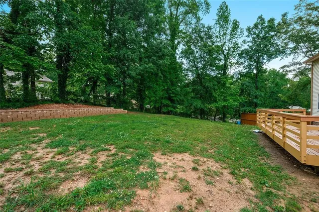 a view of a deck with a yard