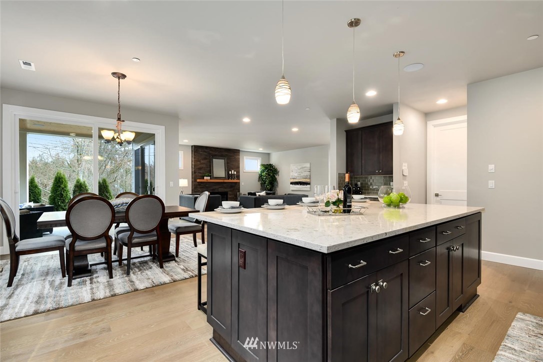 20405 4th Drive Southeast Bothell, WA 98012 - Photo 16 of 31 a kitchen with a sink dining table and chairs