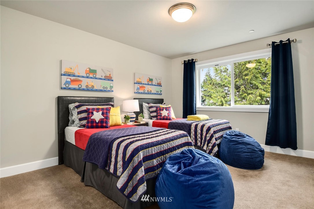 20405 4th Drive Southeast Bothell, WA 98012 - Photo 20 of 31 a bedroom with two beds and a large window