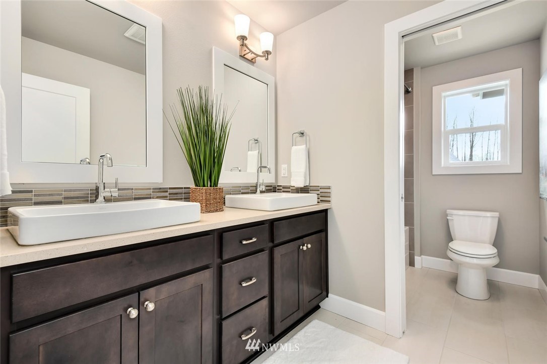 20405 4th Drive Southeast Bothell, WA 98012 - Photo 21 of 31 a bathroom with a double vanity sink and a mirror