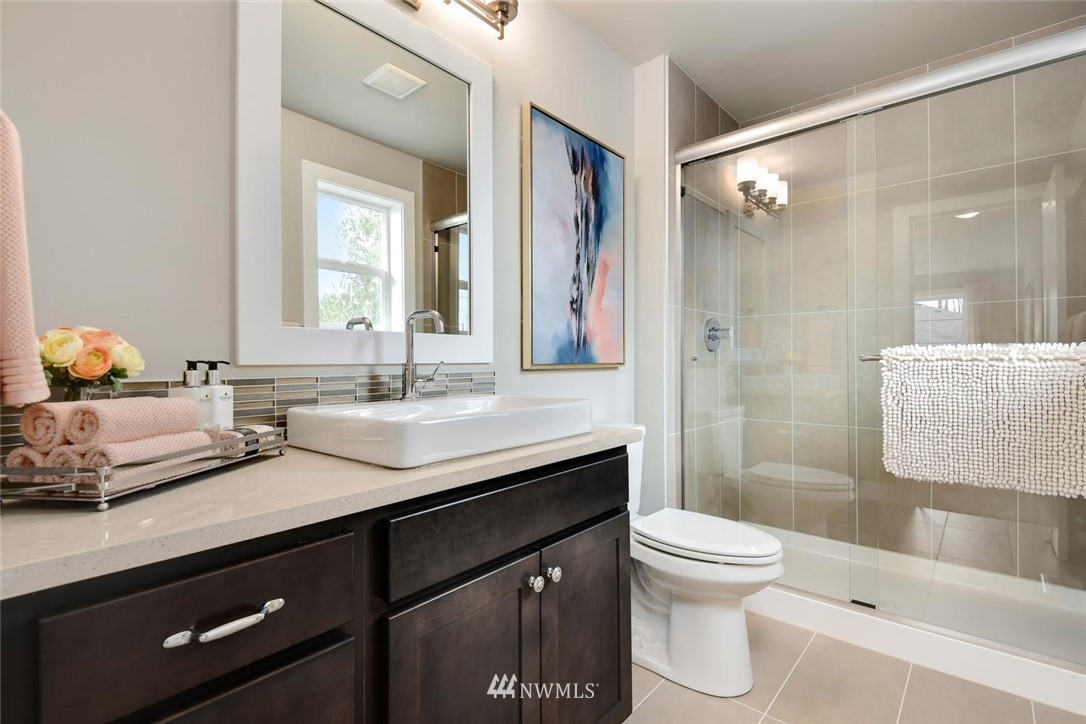 20405 4th Drive Southeast Bothell, WA 98012 - Photo 23 of 31 a bathroom with a double vanity sink toilet and shower