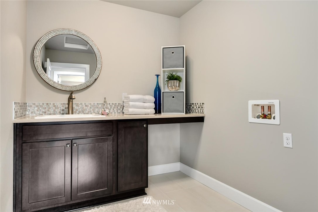 20405 4th Drive Southeast Bothell, WA 98012 - Photo 24 of 31 a bathroom with a sink and a mirror
