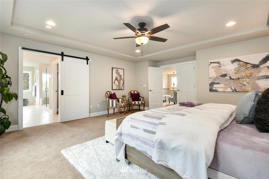 20405 4th Drive Southeast Bothell, WA 98012 - Photo 26 of 31 a bed room with a bed and a chandelier