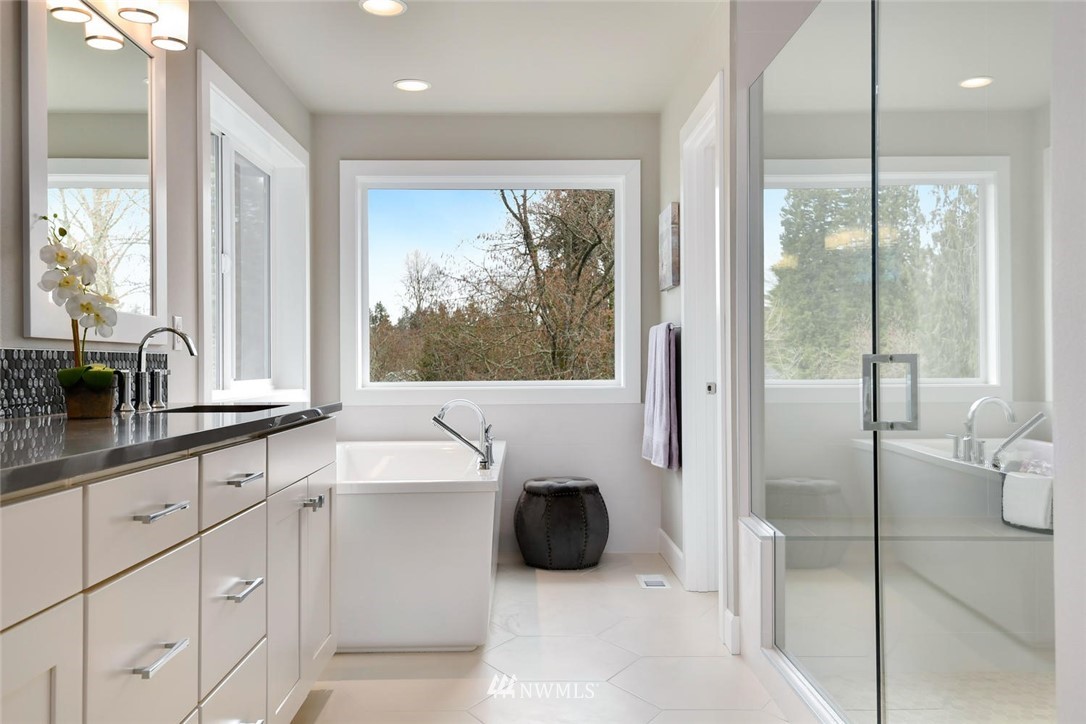 20405 4th Drive Southeast Bothell, WA 98012 - Photo 27 of 31 a bathroom with a tub sink and mirror