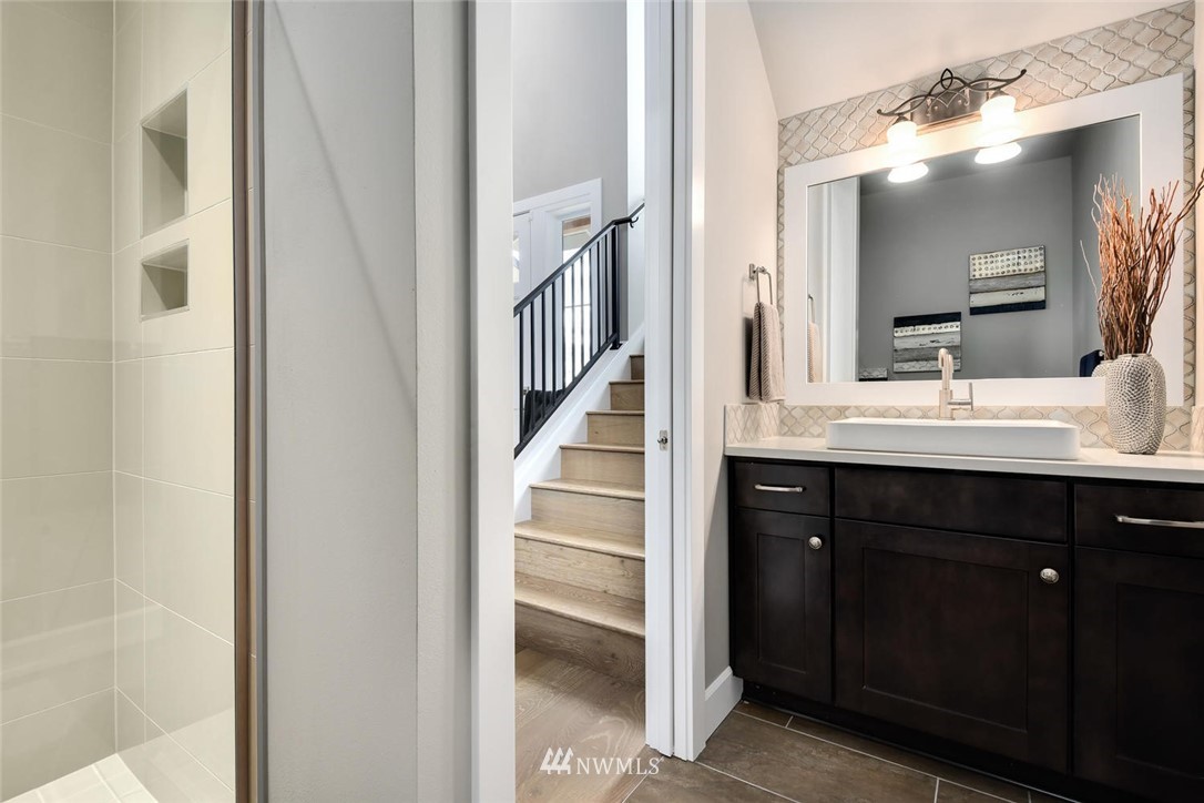 20405 4th Drive Southeast Bothell, WA 98012 - Photo 4 of 31 a bathroom with a double vanity sink and a mirror
