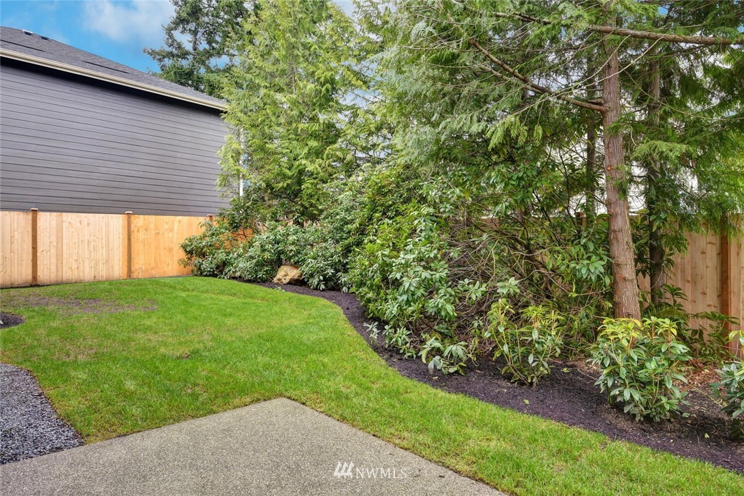 20405 4th Drive Southeast Bothell, WA 98012 - Photo 31 of 31 a view of a backyard with potted plants and large tree