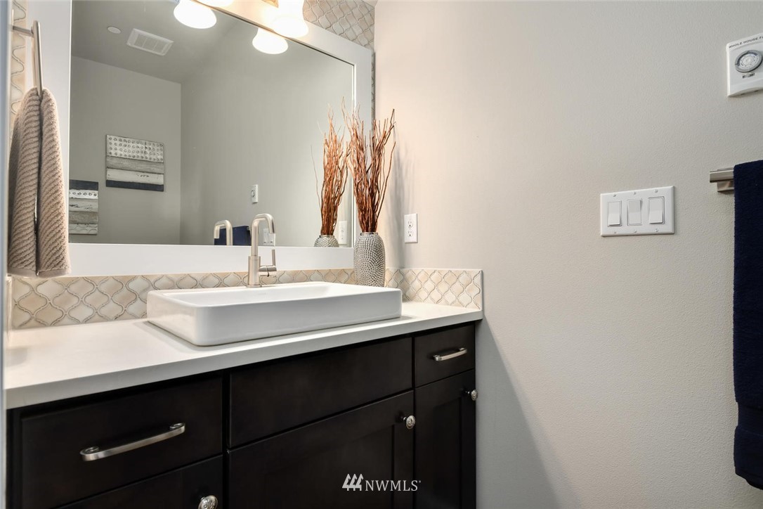 20405 4th Drive Southeast Bothell, WA 98012 - Photo 5 of 31 a bathroom with a sink and a mirror