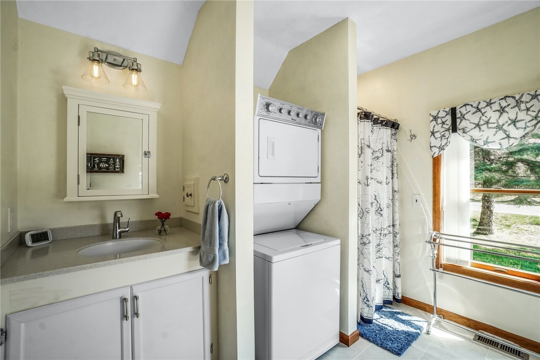 66 Sloop Street Jamestown, RI 02835 - Photo 13 of 19 Owner en Suite full Bath has a step in shower, and a full size stackable Laundry....a second Laundry is in the lower level.
