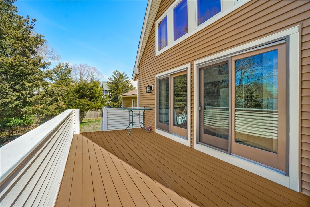 66 Sloop Street Jamestown, RI 02835 - Photo 16 of 19 This 10' x 20' Deck is accessed through newer sliders from Living Room and Dining area, and has steps to the yard!