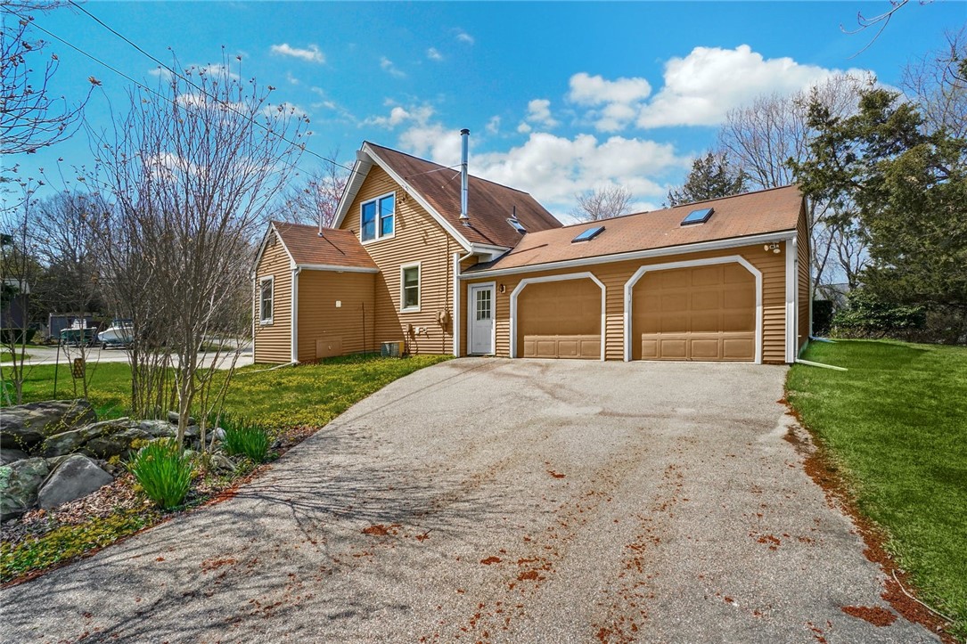66 Sloop Street Jamestown, RI 02835 - Photo 17 of 19 This 2 car Garage, added by the current Owner, has steps to the lower level from its interior. Plenty of space here too!