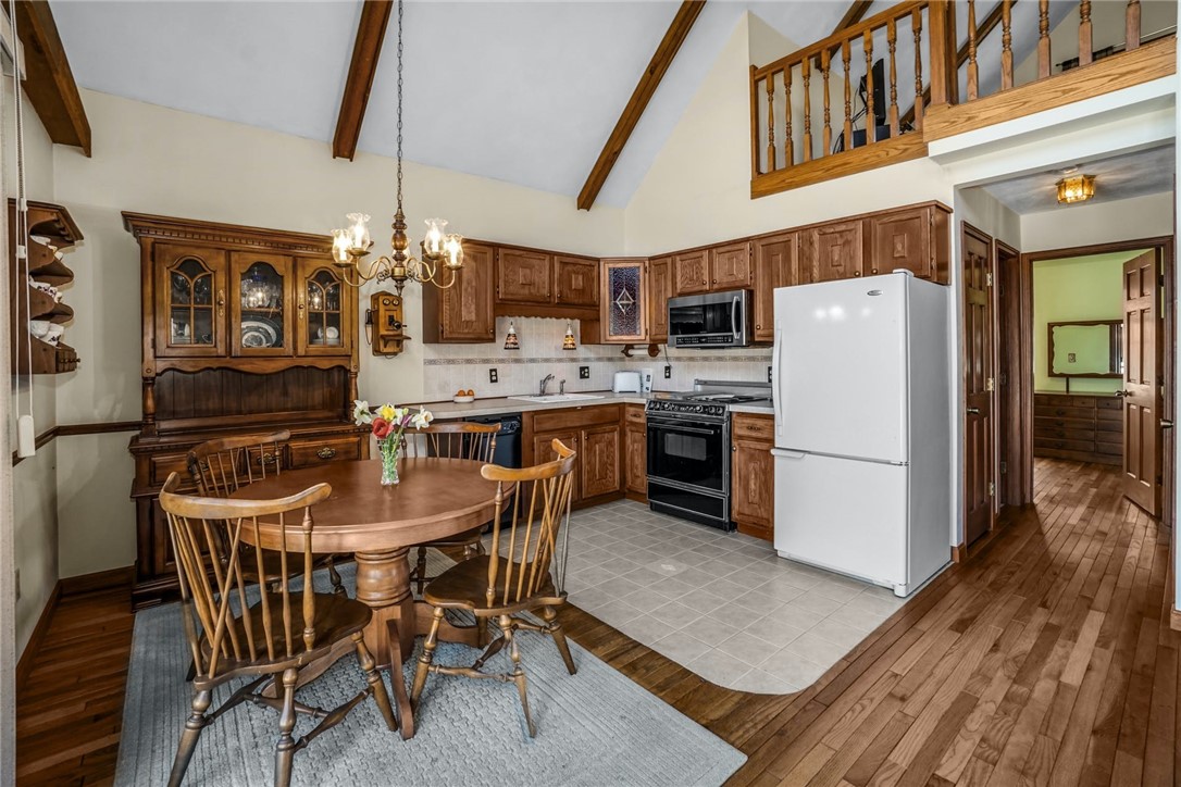 66 Sloop Street Jamestown, RI 02835 - Photo 9 of 19 Eat in Kitchen is open to Living Room and has access to the Deck!