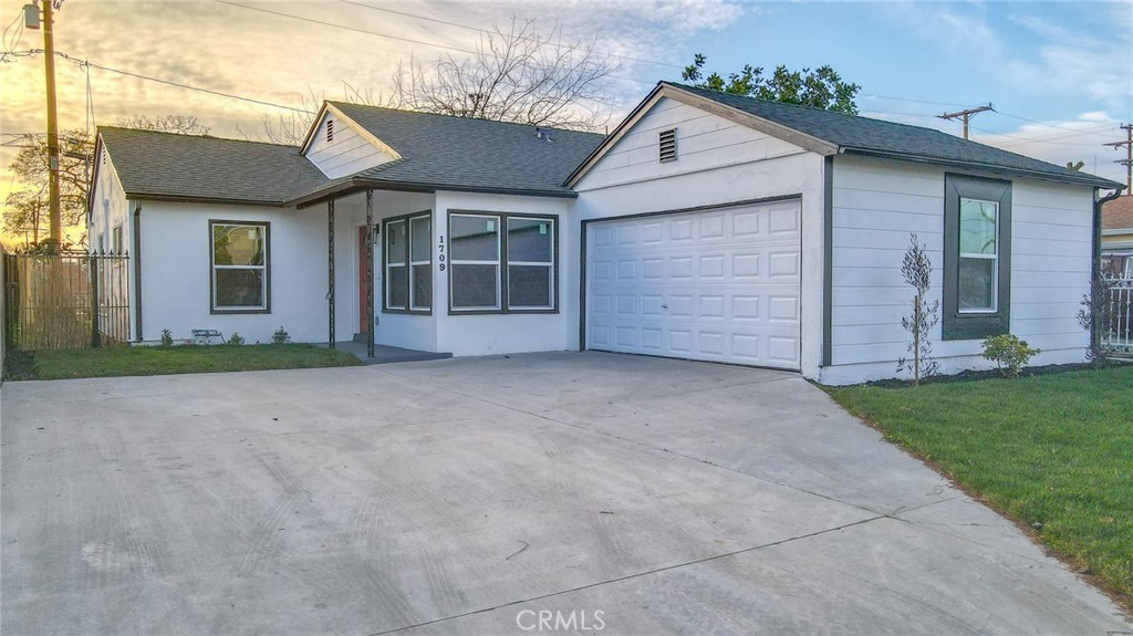 1709 North Grape Avenue Compton, CA 90222 - Photo 1 of 1 front view of a house with a yard