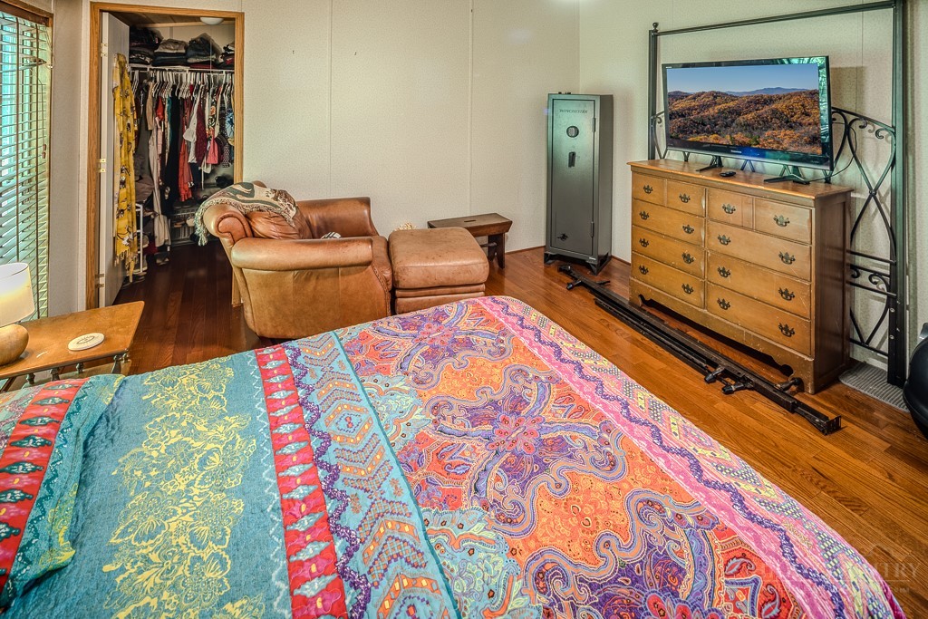 461 Reuben Wooten Road Banner Elk, NC 28604 - Photo 21 of 39 a bedroom with furniture and a flat screen tv