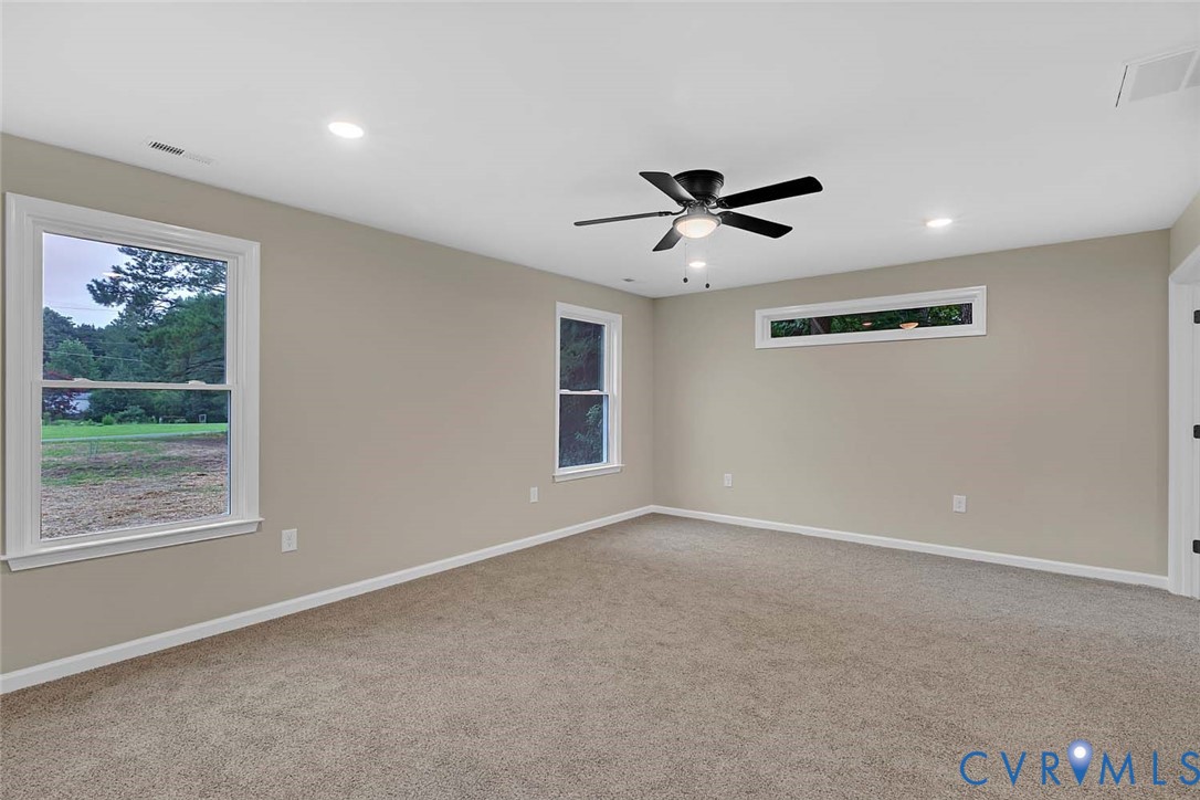 5008 Chestnut Fork Road Gloucester, VA 23061 - Photo 13 of 35 a view of a livingroom with a ceiling fan and window