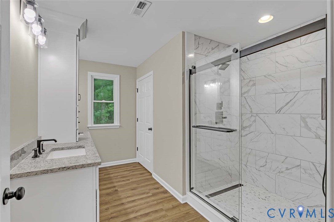 5008 Chestnut Fork Road Gloucester, VA 23061 - Photo 16 of 35 a bathroom with a granite countertop shower sink and vanity