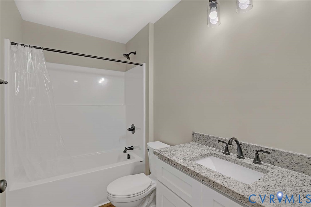 5008 Chestnut Fork Road Gloucester, VA 23061 - Photo 25 of 35 a bathroom with a granite countertop sink toilet and shower
