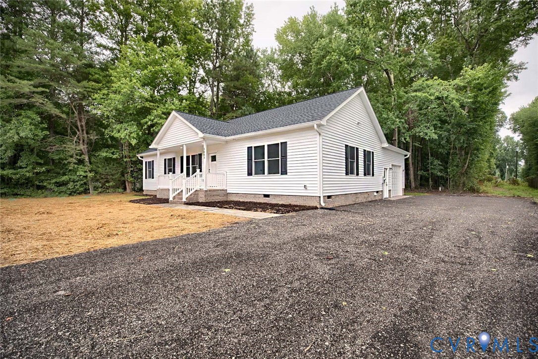 5008 Chestnut Fork Road Gloucester, VA 23061 - Photo 30 of 35 a view of a house with backyard and trees